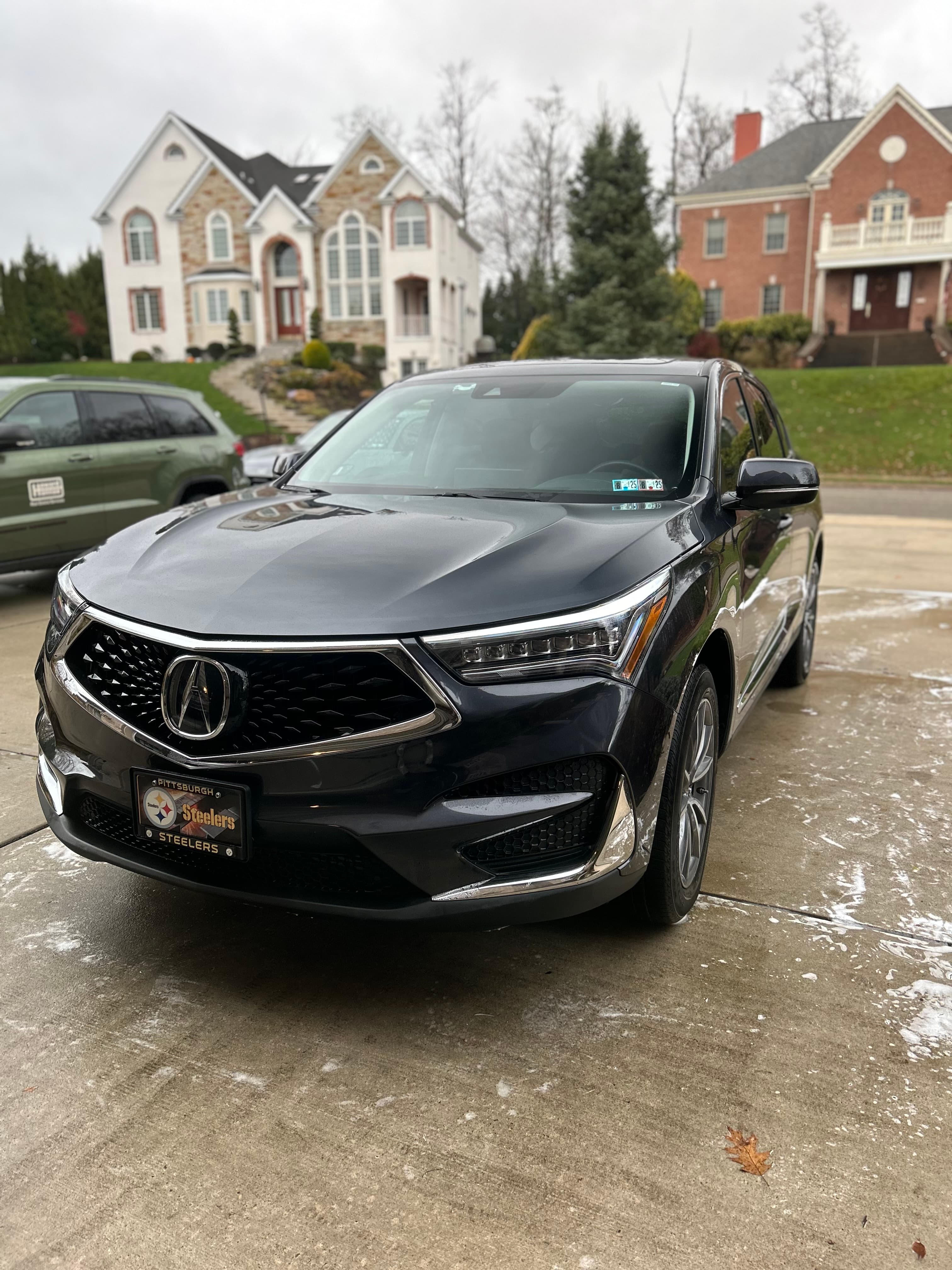 Hand wash in progress on an Acura RDX