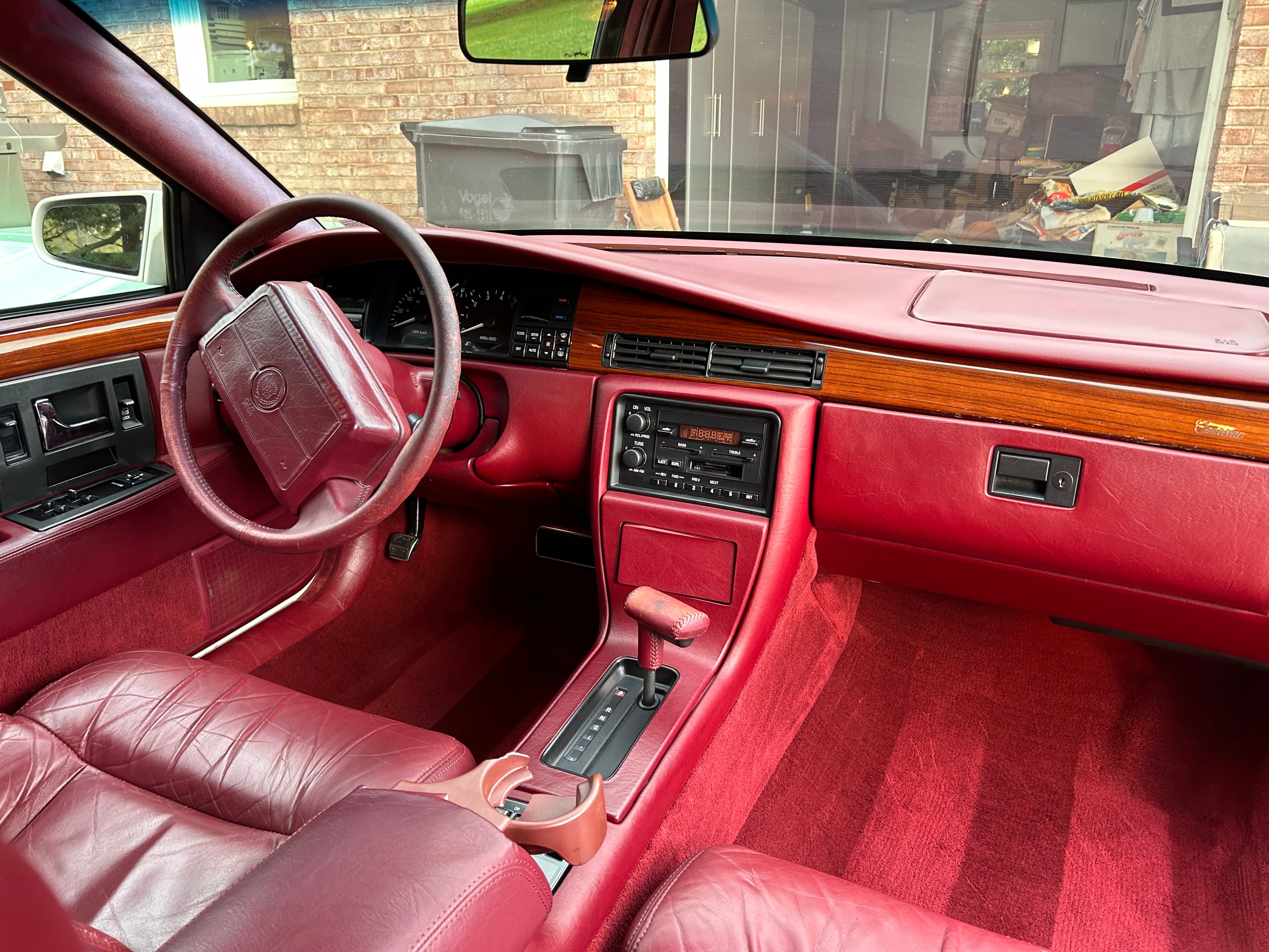 Detailed maroon leather interior of a Cadillac